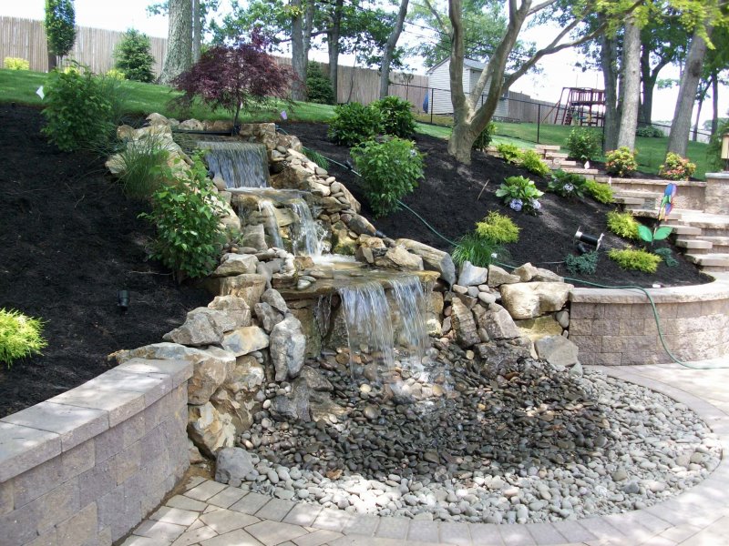 pondless waterfall with moss rock boulders